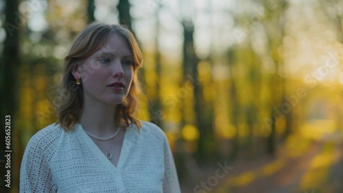 smiling girl walking in a forest