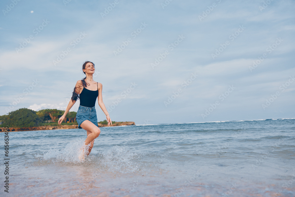 woman happiness sunset running sea travel lifestyle smile young summer beach