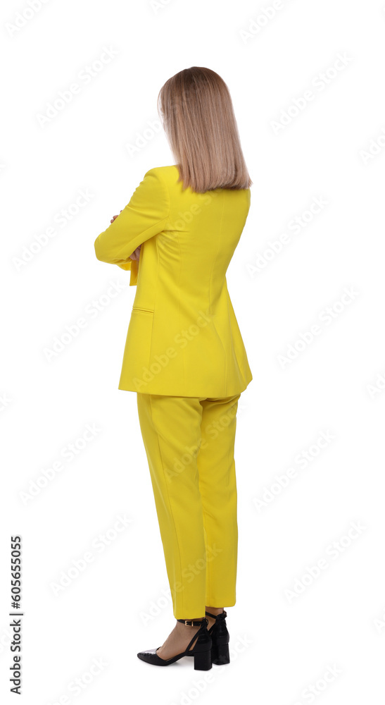 Businesswoman in suit standing on white background, back view Businesswoman in suit standing on white background, back view