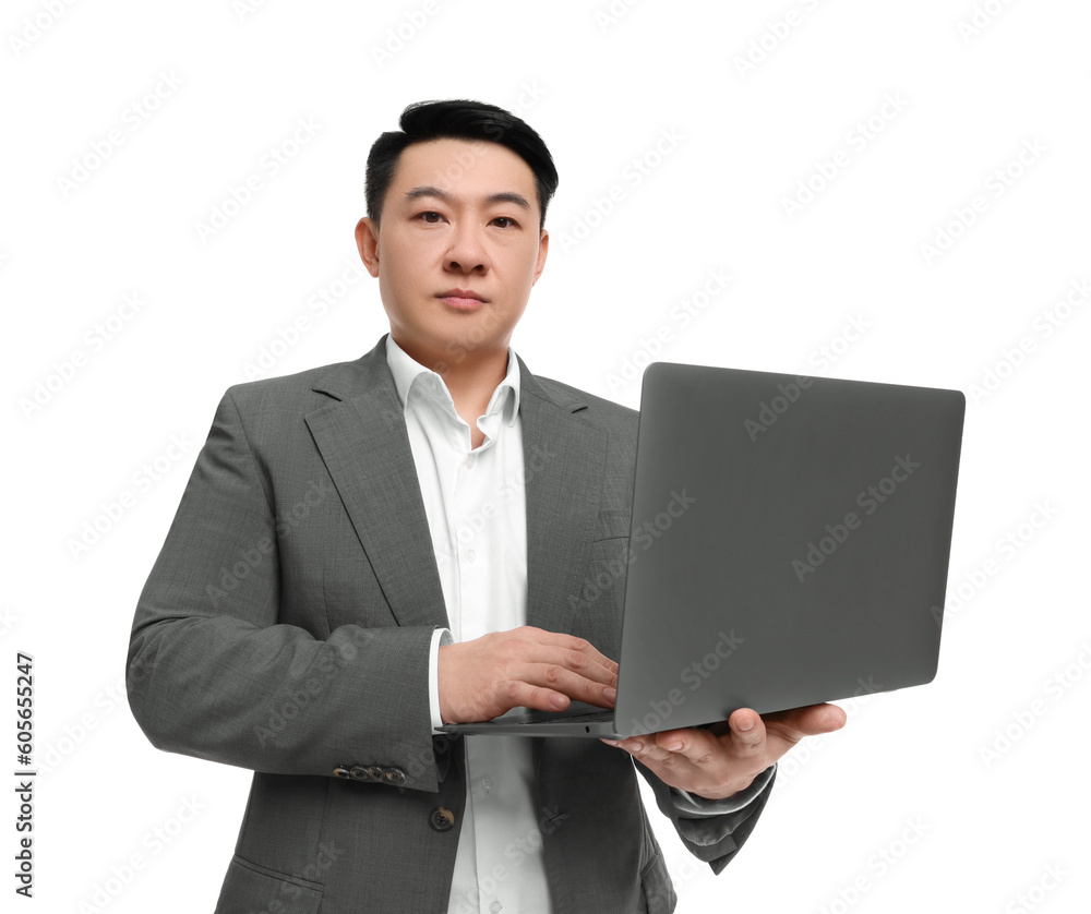 Businessman in suit working on laptop against white background Businessman in suit working on laptop against white background