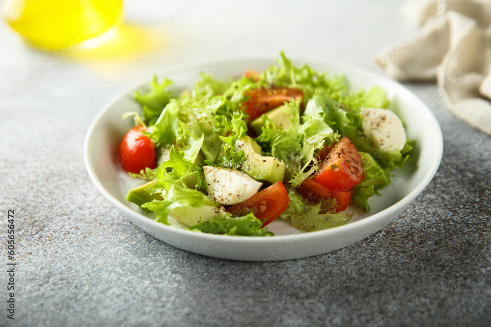 Healthy avocado salad with mozzarella cheese