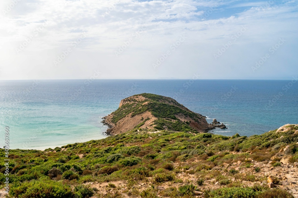 Aerial view of a rocky sandy seashore with a cliff in Kef Abbed, Tunisia