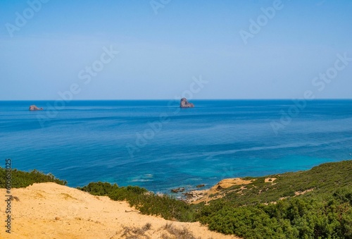Aerial view of a beautiful seashore with a rocky cliff in Kef Abbed, Tunisia