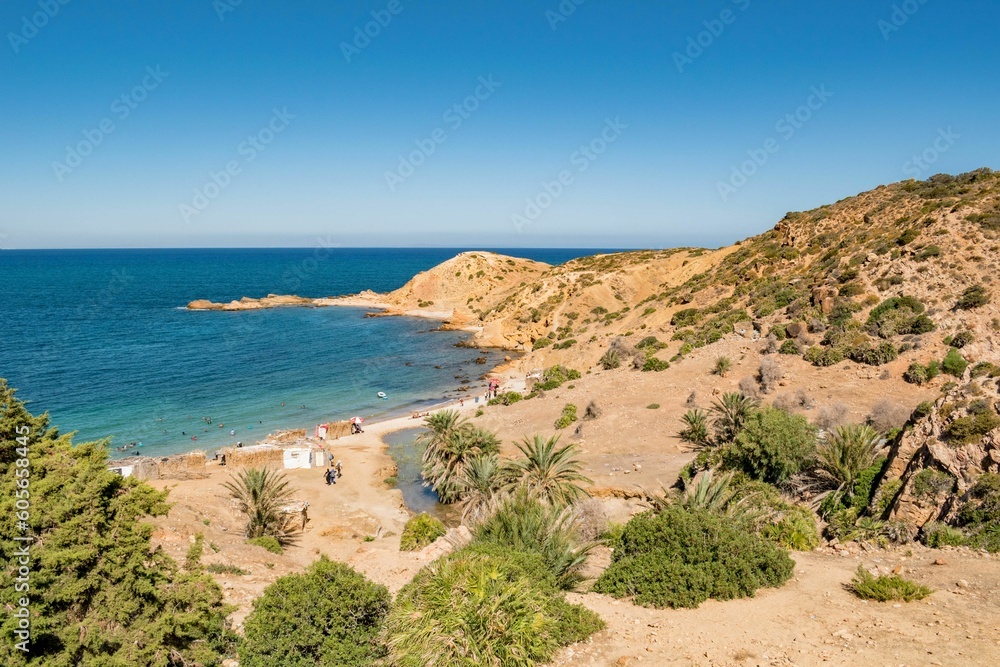 Sandy mountains with green vegetation on the coast of Korbous, Tunisia