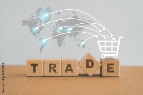 For Import or Export Shopping online or e-commerce finance delivery service store product shipping, trade, supplier concept TRADE text on wooden cube block with shopping and world map