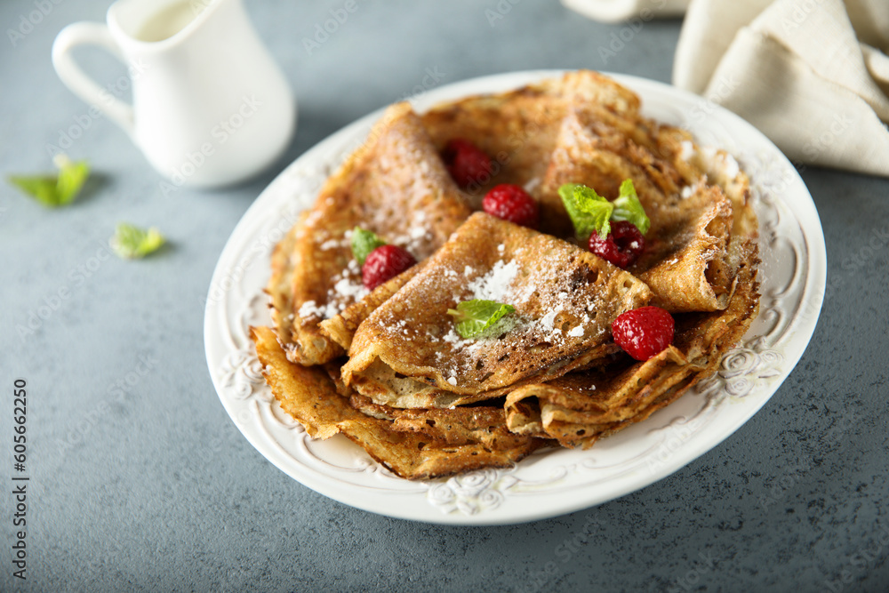 Traditional homemade crepes with raspberry Traditional homemade crepes with raspberry