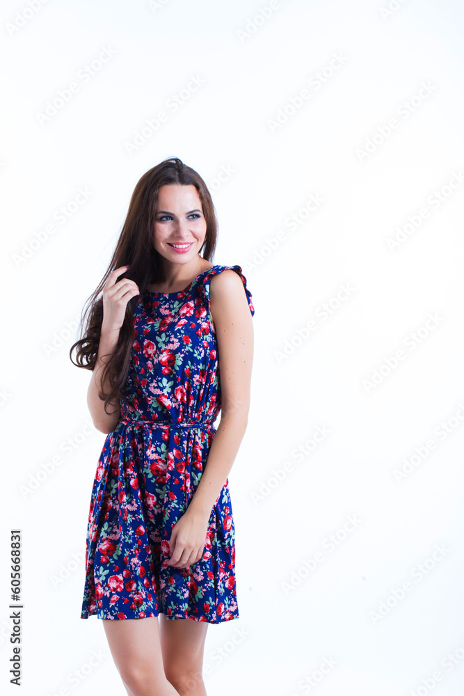 Beautiful charming woman in a summer dress on a white background Beautiful charming woman in a summer dress on a white background