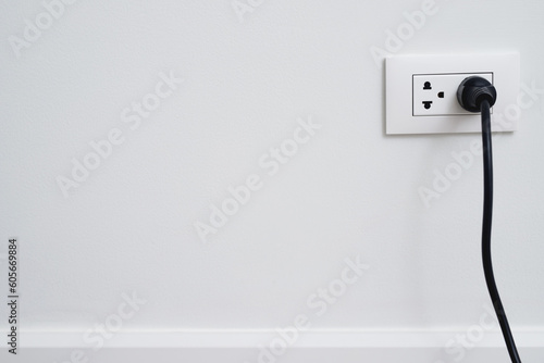 Close Up the electrical power socket and plug socket on wall. © methaphum