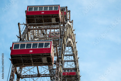 Close up of a ferris wheel in Prater, Vienna with blue sky in the background