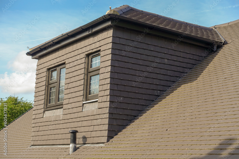 Obraz premium Grey tile covered side dormer of modern new build property