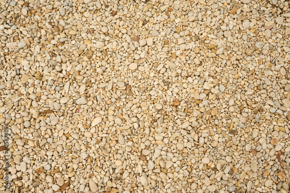 The texture of small multicolored pebbles as a background. The texture of small multicolored pebbles as a background.