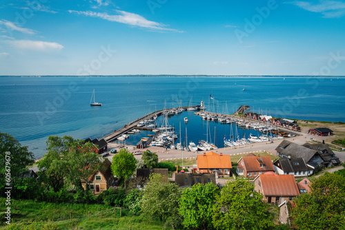 View over Kyrkbacken harbor on the Swedish island Ven in the Oresund strait. Denmark can be seen in the background. photo