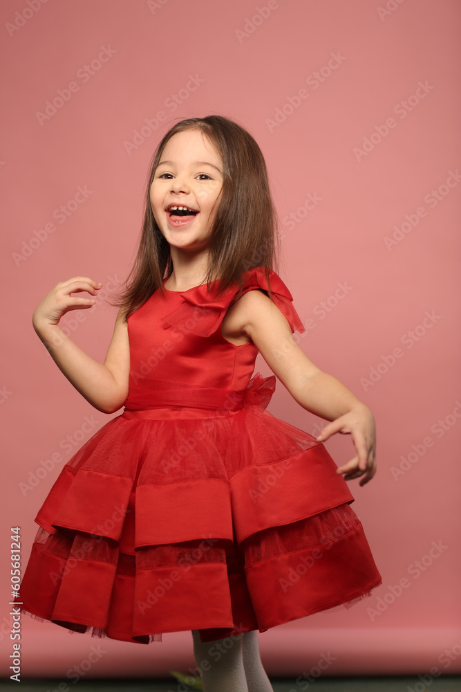 cute little girl in red dress happy closeup portrait on pink background cute little girl in red dress happy closeup portrait on pink background