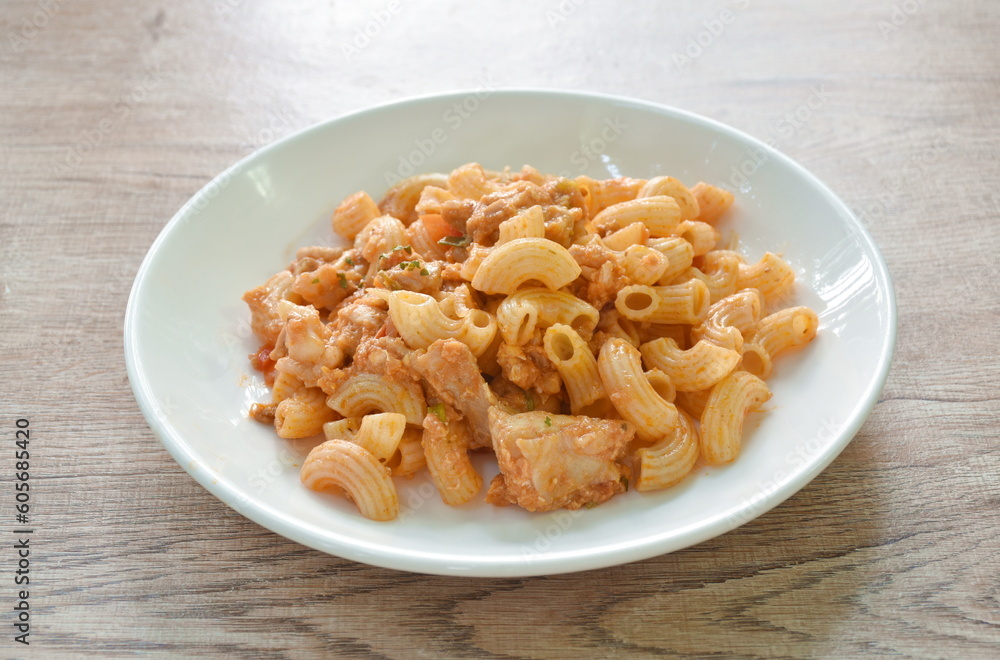 stir fried rigatoni pasta with chicken dressing ketchup on plate stir fried rigatoni pasta with chicken dressing ketchup on plate