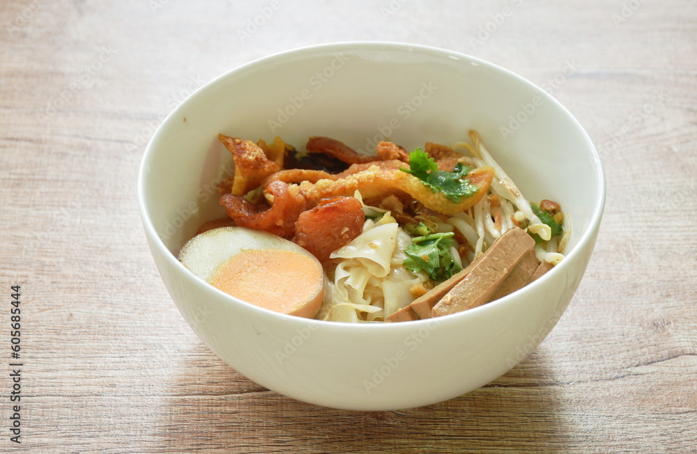 steamed large rice noodles topping slice fried Chinese sausage and pork belly with bean sprout dressing black soy sauce on bowl steamed large rice noodles topping slice fried Chinese sausage and pork belly with bean sprout dressing black soy sauce on bowl