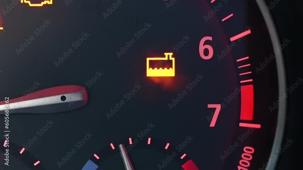 Dashboard warning lights in car. Problems with cooling system on engine. Coolant warning light