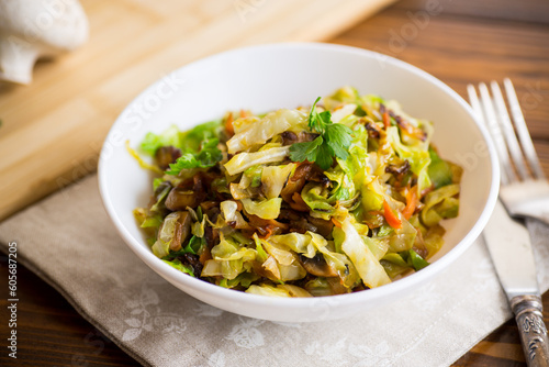 cabbage early fried with mushrooms, carrots and vegetables