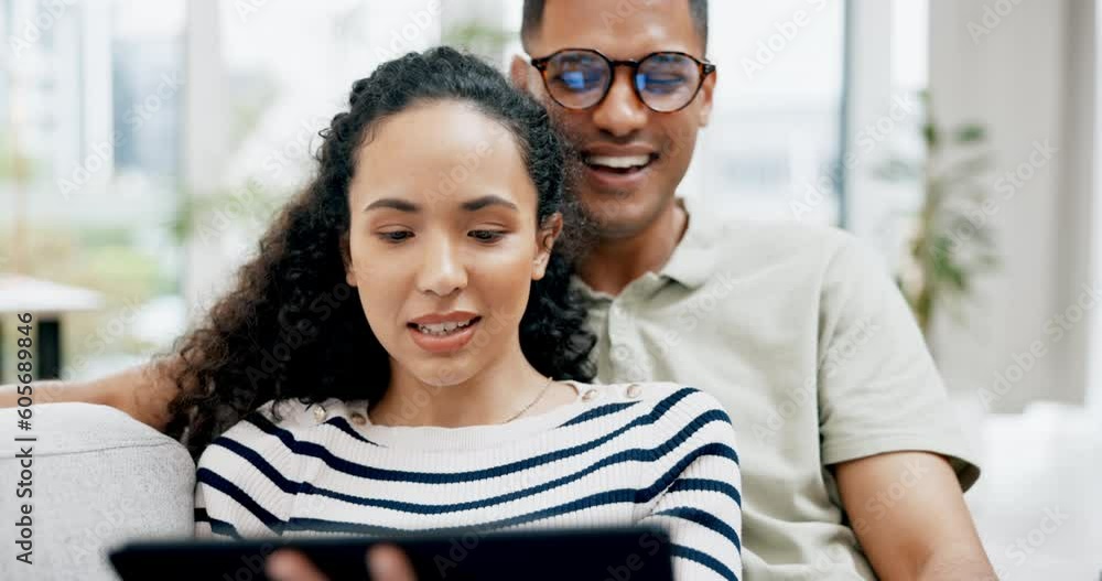 Relax, tablet and pointing with couple on sofa for planning, social media or connection. Communication, internet and technology with man and woman in living room at home for streaming and website Relax, tablet and pointing with couple on sofa for planning, social media or connection. Communication, internet and technology with man and woman in living room at home for streaming and website
