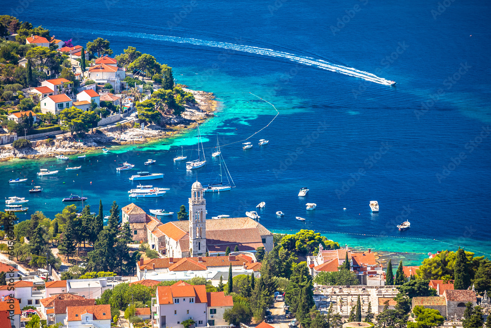 Old town of Hvar bay and harbor aerial view