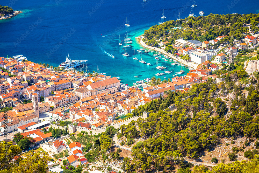 Old town of Hvar bay and harbor aerial view
