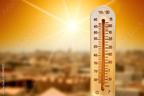 A thermometer with the sun in the background. Generative AI. Thermometer showing extreme temperatures. Thermometer showing extreme temperatures. photo