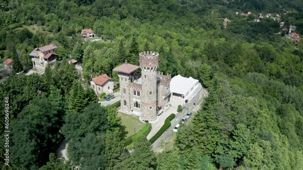 Marquee tent erected next to Castello Becchi surrounded by lush woods, aerial Marquee tent erected next to Castello Becchi surrounded by lush woods, aerial