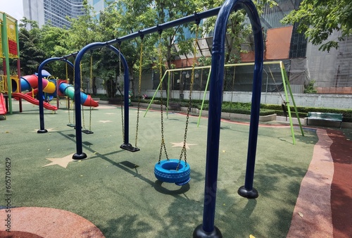 Children's playgrounds in the park, swings and slides for children to play.