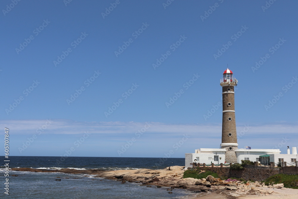 
photo of lighthouse on the beach