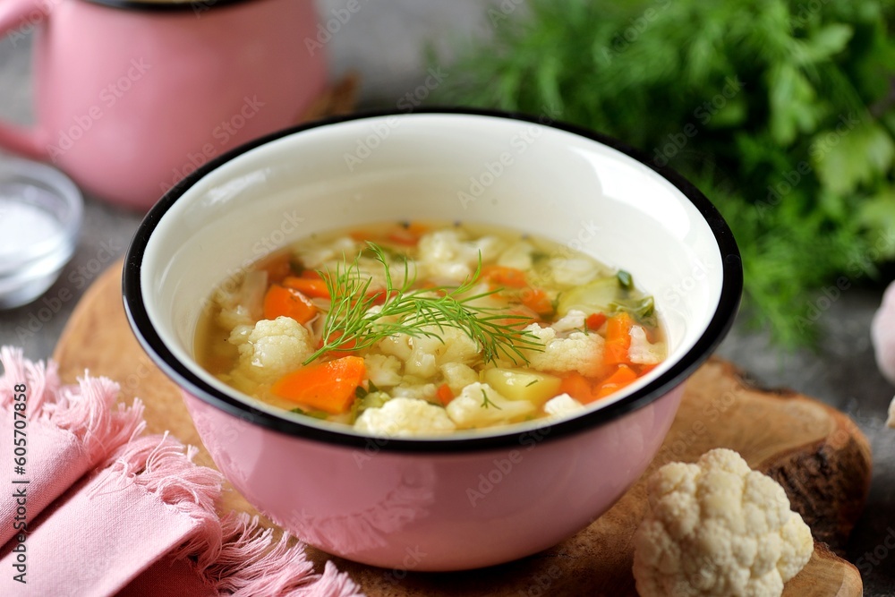 Healthy soup from cauliflower, potatoes, carrots, onions and dill