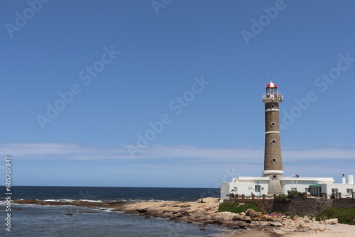  photo of lighthouse on the beach