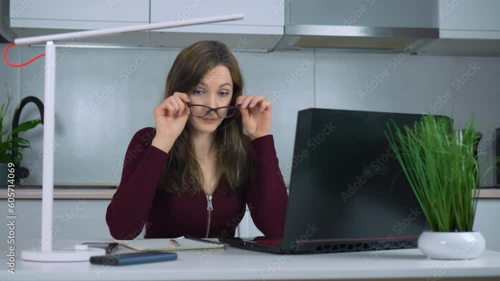 Depressed businesswoman working late at night in home office, feeling exhausted and experiencing migraine headaches. Busy worker freelancer working on modern tech notebook device Depressed businesswoman working late at night in home office, feeling exhausted and experiencing migraine headaches. Busy worker freelancer working on modern tech notebook device