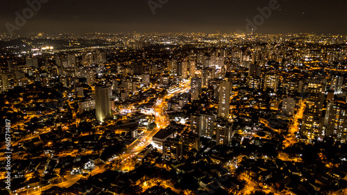 view from above the city of São Paulo at night, city lights, buildings and houses lit, Brazil