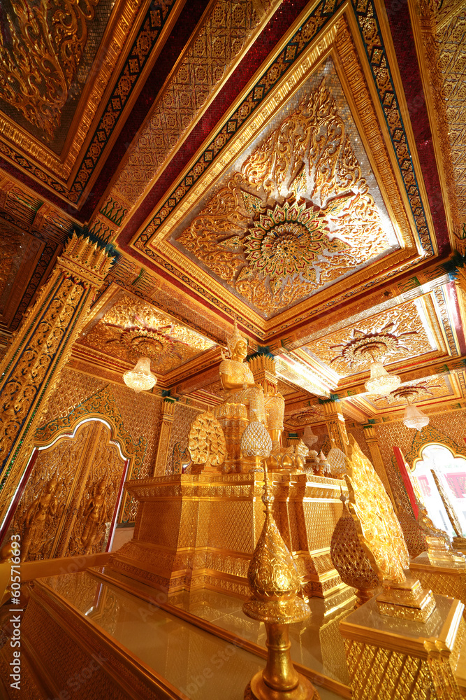 Obraz premium Inside the Golden Church of Wat Tha Sung, Uthai Thani Province, Thailand, everything in here, including the Buddha images, ceilings and doors, are all gold. Taken 7 May 2023.