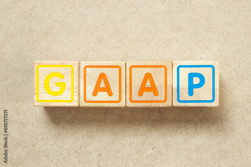 Wooden alphabet letter block in word GAAP (Abbreviation of Generally accepted accounting principles) on wood background Wooden alphabet letter block in word GAAP (Abbreviation of Generally accepted accounting principles) on wood background