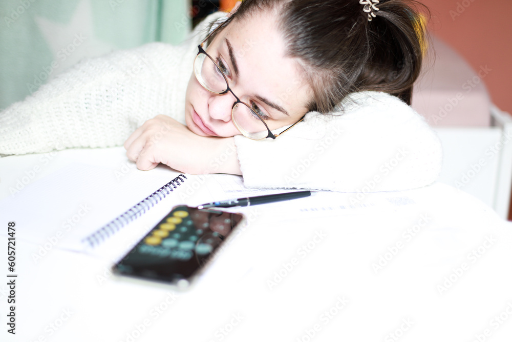 A woman is sad because of her debts. The woman counted her debts and is sad A woman is sad because of her debts. The woman counted her debts and is sad
