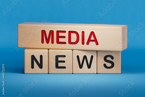 Media News symbol. Wooden blocks with words 'Media News'. Wooden cube blocks. Copy space.3D rendering on blue background. 