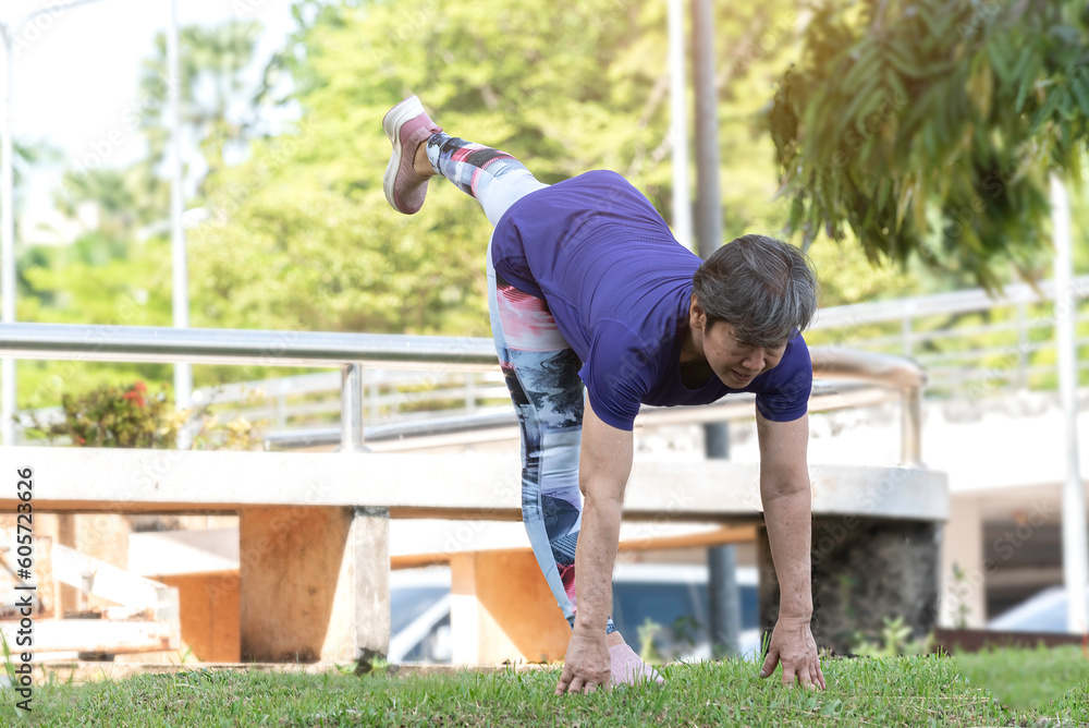 late age woman attractive in sportswear practicing and exercise outdoor in yoga style pose yoga lesson. late age woman attractive in sportswear practicing and exercise outdoor in yoga style pose yoga lesson.