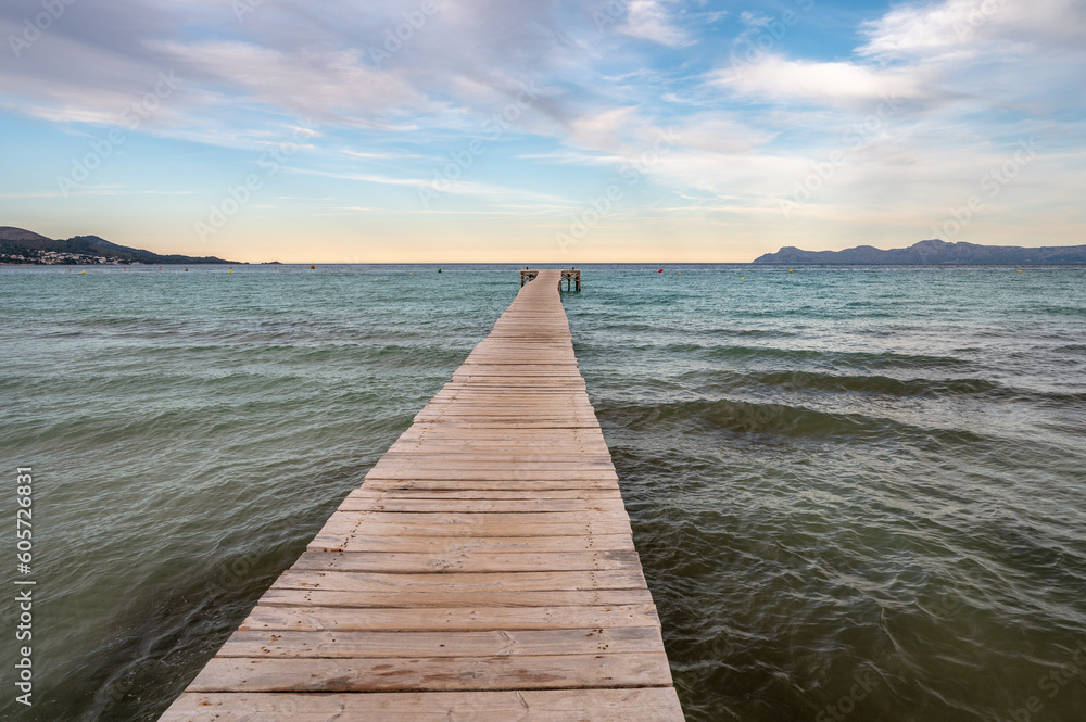 A long wooden deck in Muro Beach. the longest sandy beach in Majorca Island.