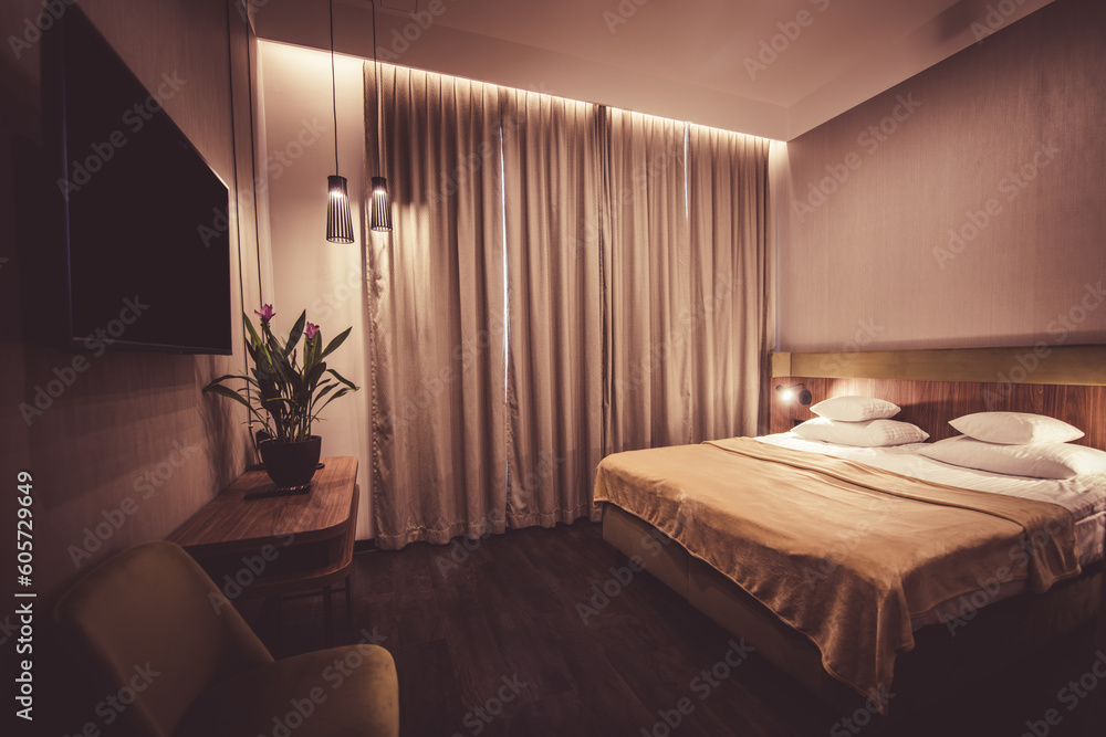 Fototapeta premium Hotel room with closed curtains at night.