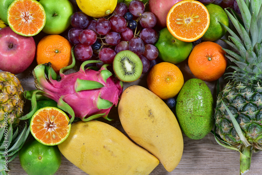 assorted fruits, top view healthy food concept Including high vitamin fruits, fresh fruits, thai fruits assorted fruits, top view healthy food concept Including high vitamin fruits, fresh fruits, thai fruits