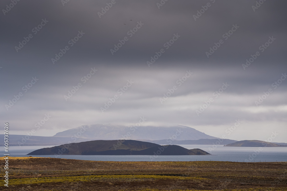 Fototapeta premium Landscape in Iceland. Dramatic sky clouds over hills mountains and lakes of Iceland.