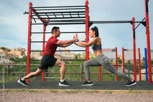 Couple doing sport together in a park of a town
