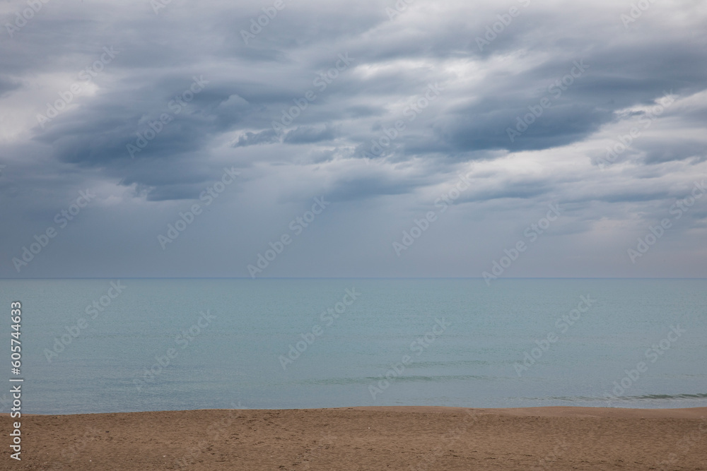 Italian maritime landscape on a gray spring day. Very cloudy sky