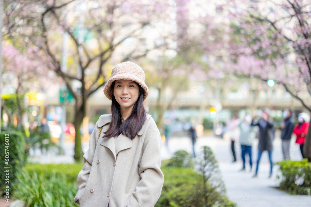 Woman with winter clothing in the city and smile to camera Woman with winter clothing in the city and smile to camera