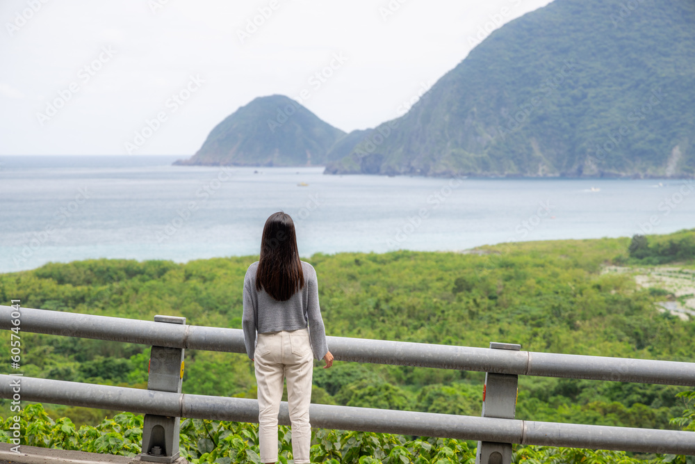 Woman look at the sea and mountain