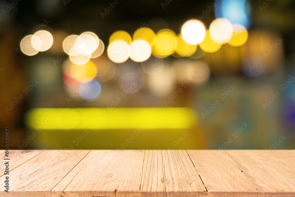 Empty wooden table in front of abstract blurred background of coffee shop . can be used for display Mock up  of product