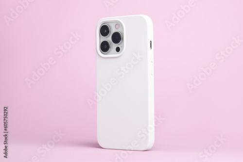 iPhone 14 Pro Max starlight in white case back side view isolated on pink background, phone cover mock up