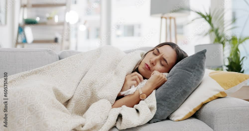Sick woman, blanket and flu on sofa from cold, allergies and winter