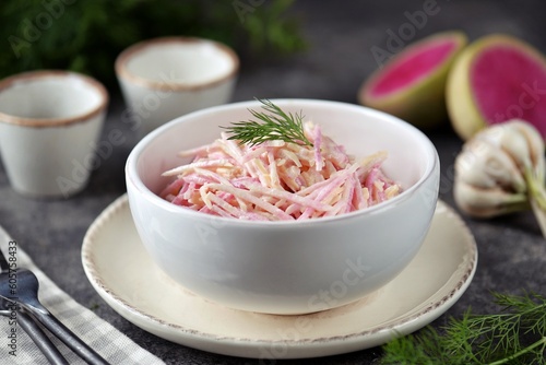 Pink radish salad with cheese, garlic and yogurt