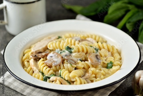 Рasta with mushrooms, chicken and spinach in a creamy sauce